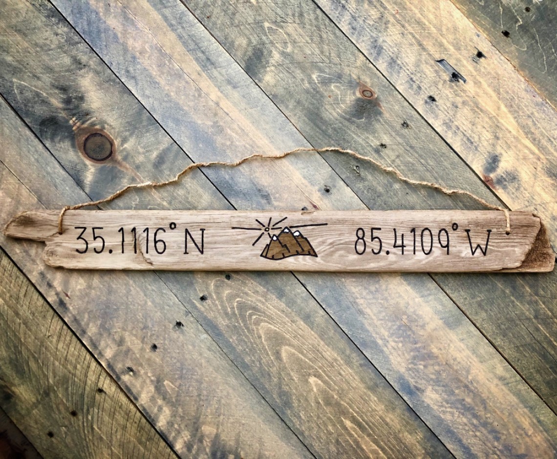Reclaimed driftwood mountain sign with latitude longitude